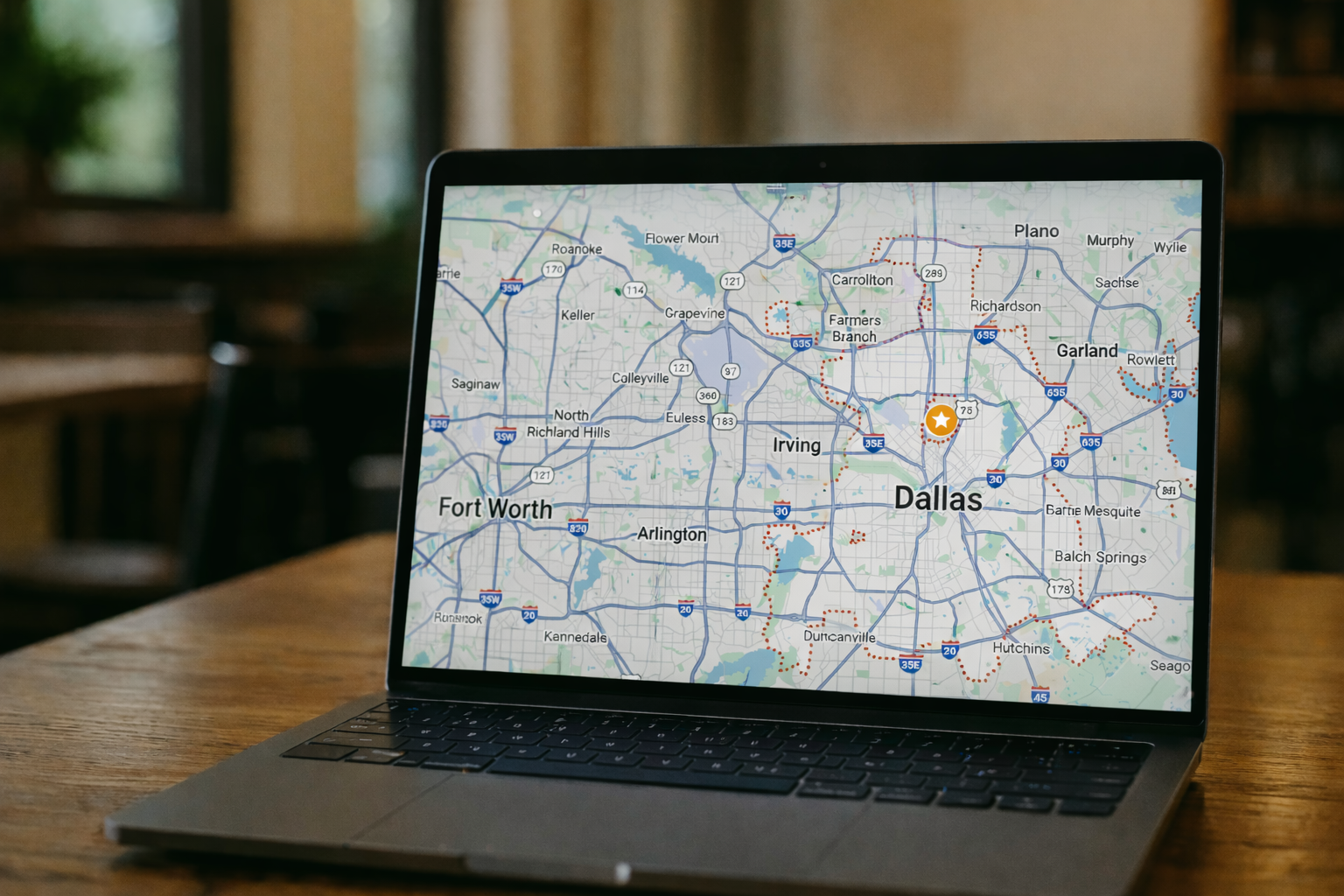 dallas-restaurant-visibility-audit-hero Laptop displaying a Dallas map used to analyze restaurant visibility and local search presence